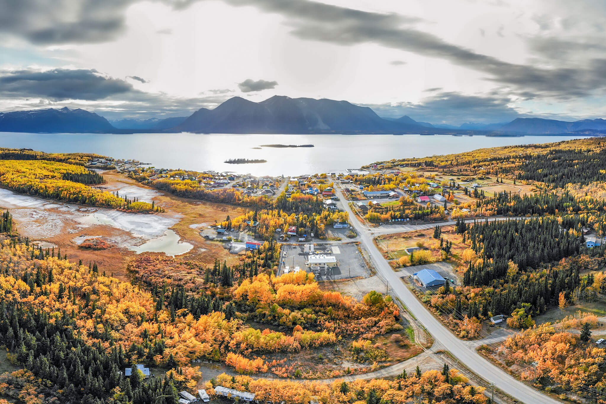Mountains and lake under cloudy sky